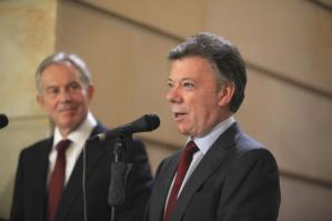 Colombian President Manuel Santos speaks as former British PM Blair looks on before a news conference at the Presidential Palace in Bogota