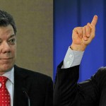 Juan Manuel Santos (L) and Alvaro Uribe