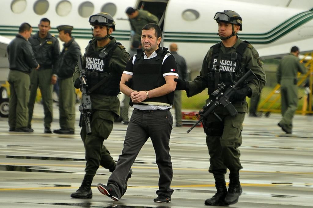 Daniel Barrera being escorted by the police in Colombia in 2013 for his extradition to the United States. Luis Acosta/Agence France-Presse — Getty Images 