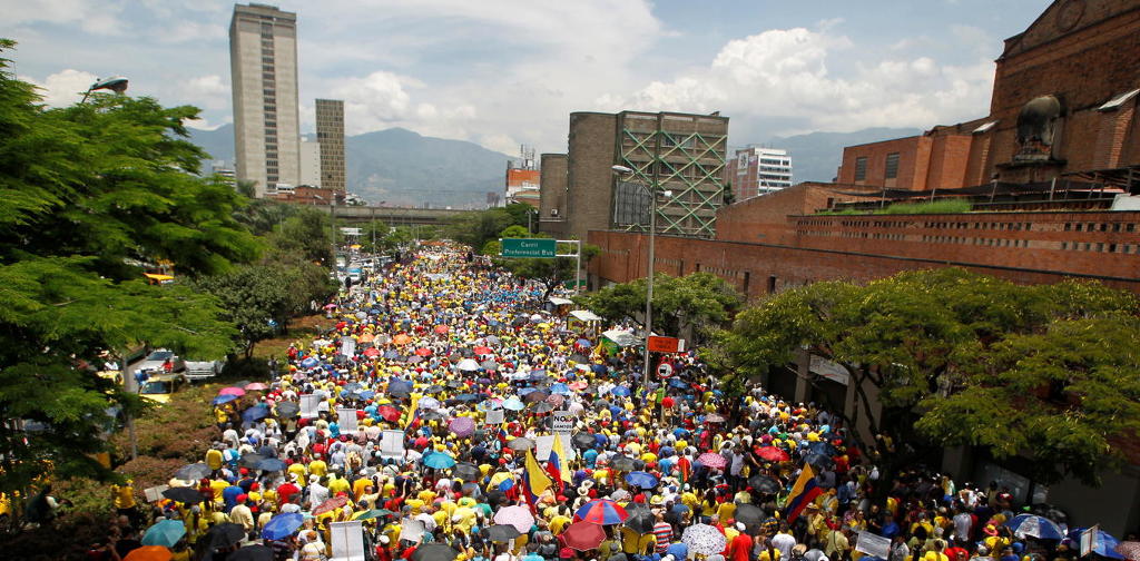 Demonstrators march during a protest against corruption, President Juan Manuel Santos and the government's peace agreement with the Revolutionary Armed Forces of Colombia (FARC), in Medellin